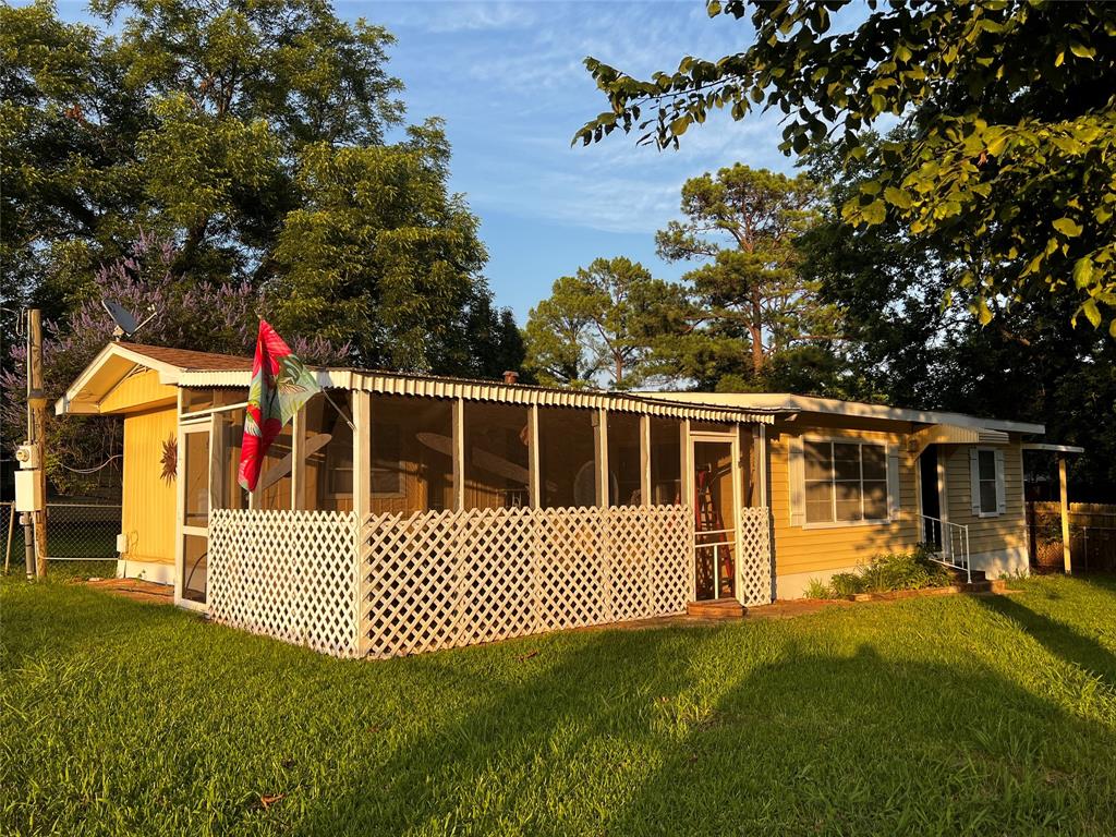 a view of a house with a small yard