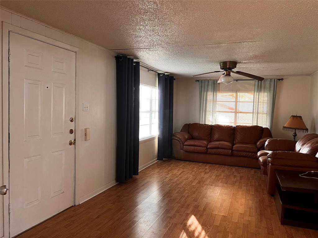 1036 Paradise Cove Road Pottsboro, TX 75076 - Photo 13 of 40 a living room with furniture and a window
