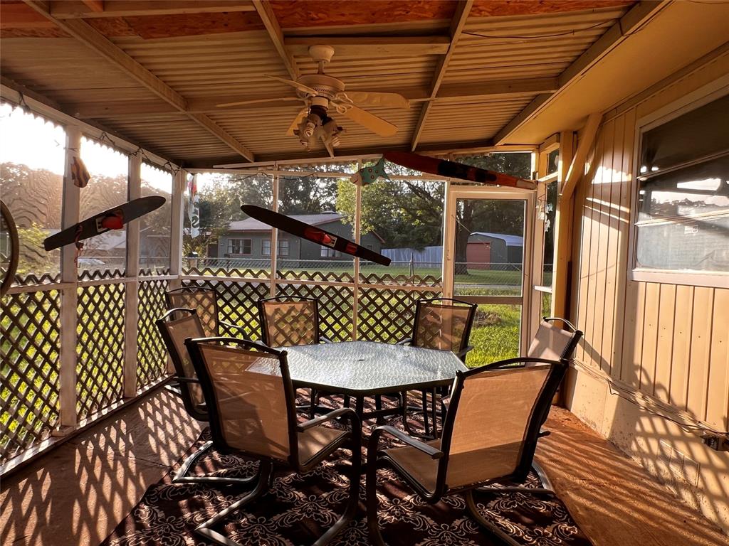 1036 Paradise Cove Road Pottsboro, TX 75076 - Photo 15 of 40 a view of a chairs and table in the patio