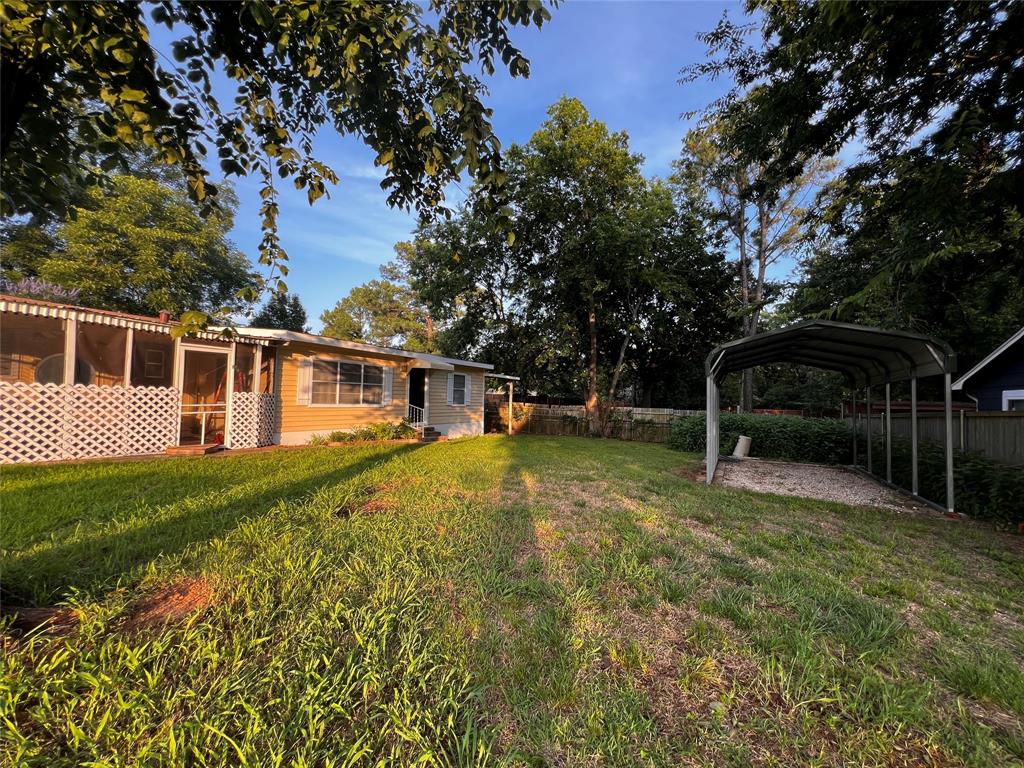 1036 Paradise Cove Road Pottsboro, TX 75076 - Photo 23 of 40 a view of a house with a yard