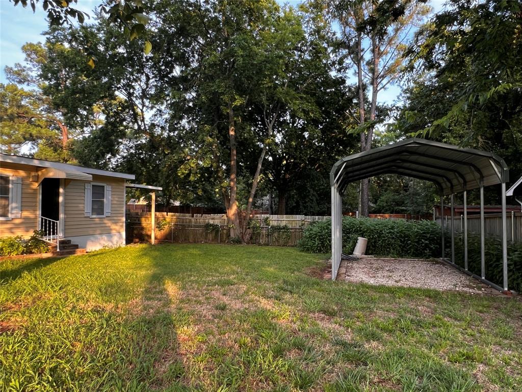1036 Paradise Cove Road Pottsboro, TX 75076 - Photo 24 of 40 a view of a yard with a car parked in it