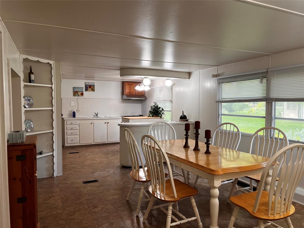 1036 Paradise Cove Road Pottsboro, TX 75076 - Photo 10 of 40 a view of a dining room with furniture window and outside view