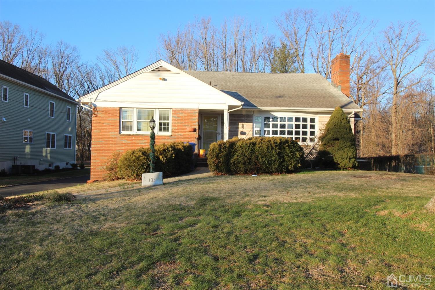 103 Jordan Road Colonia, NJ 07067 - Photo 1 of 4 a front view of a house with a yard