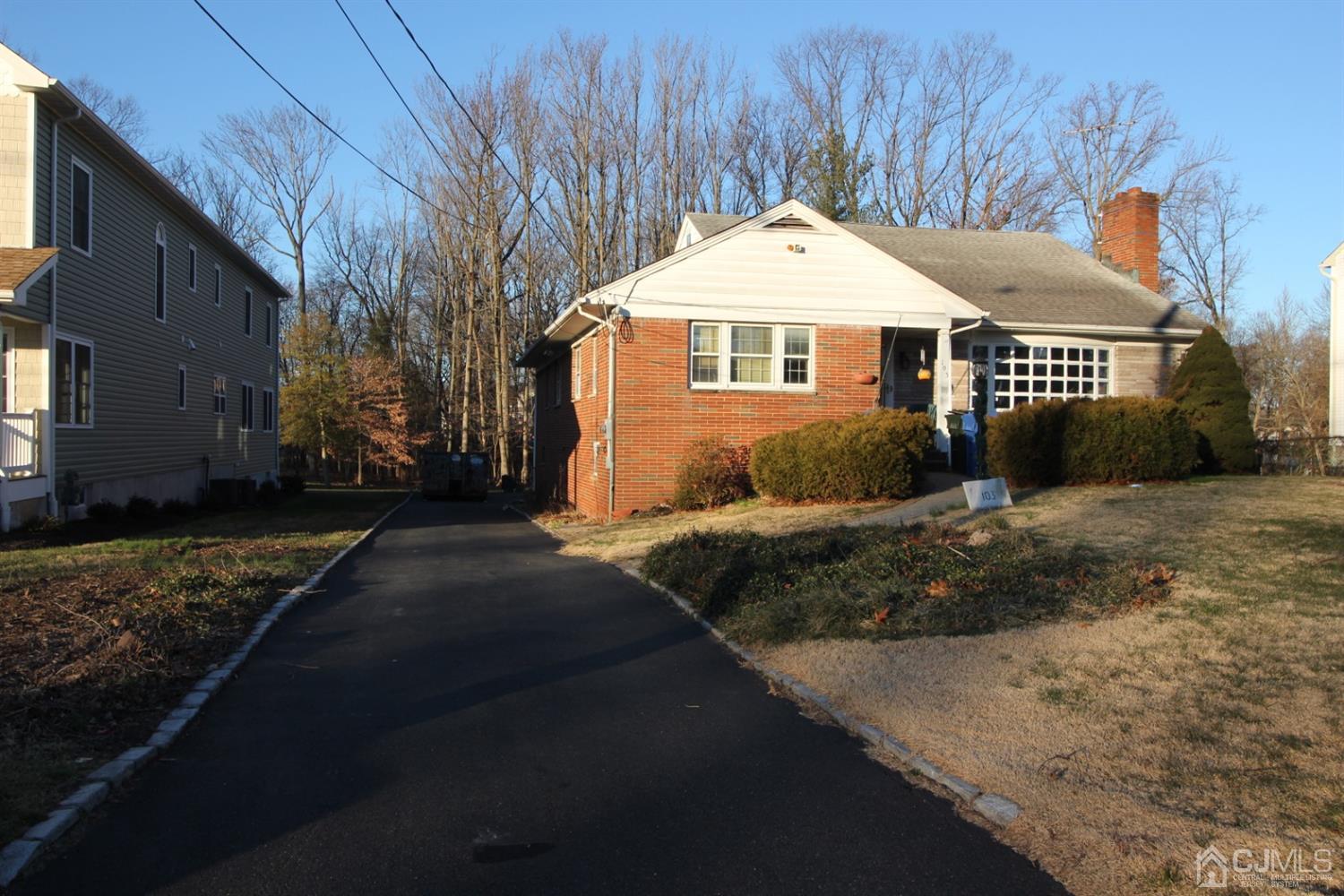 103 Jordan Road Colonia, NJ 07067 - Photo 2 of 4 a front view of a house with a yard