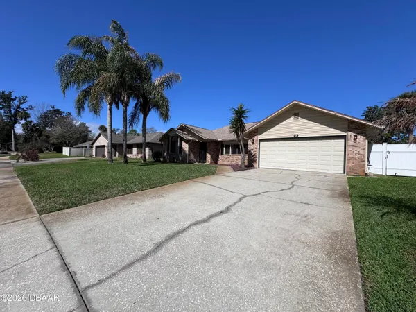 a view of house with yard