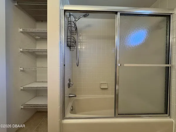 a view of an empty room with a fireplace