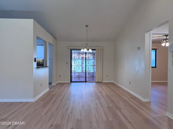 a kitchen with granite countertop wooden cabinets and a stove top oven