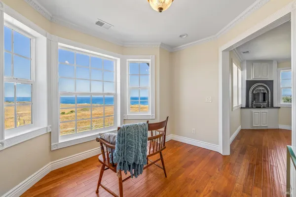 a view of a dining room with furniture window and wooden floor