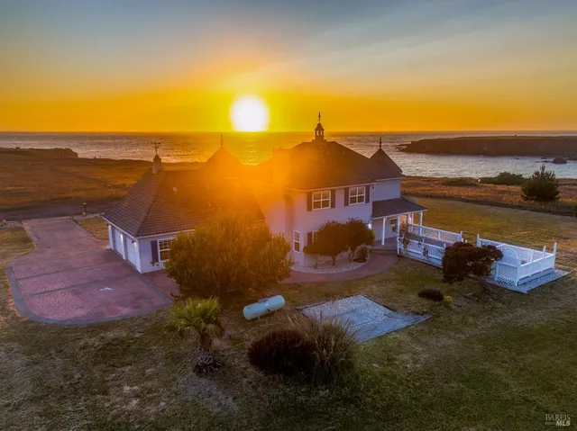 a view of a lake with a house in the background
