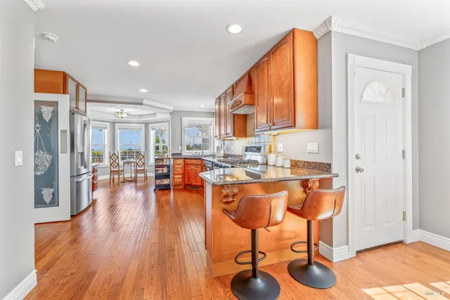 a living room with fireplace furniture and a wooden floor