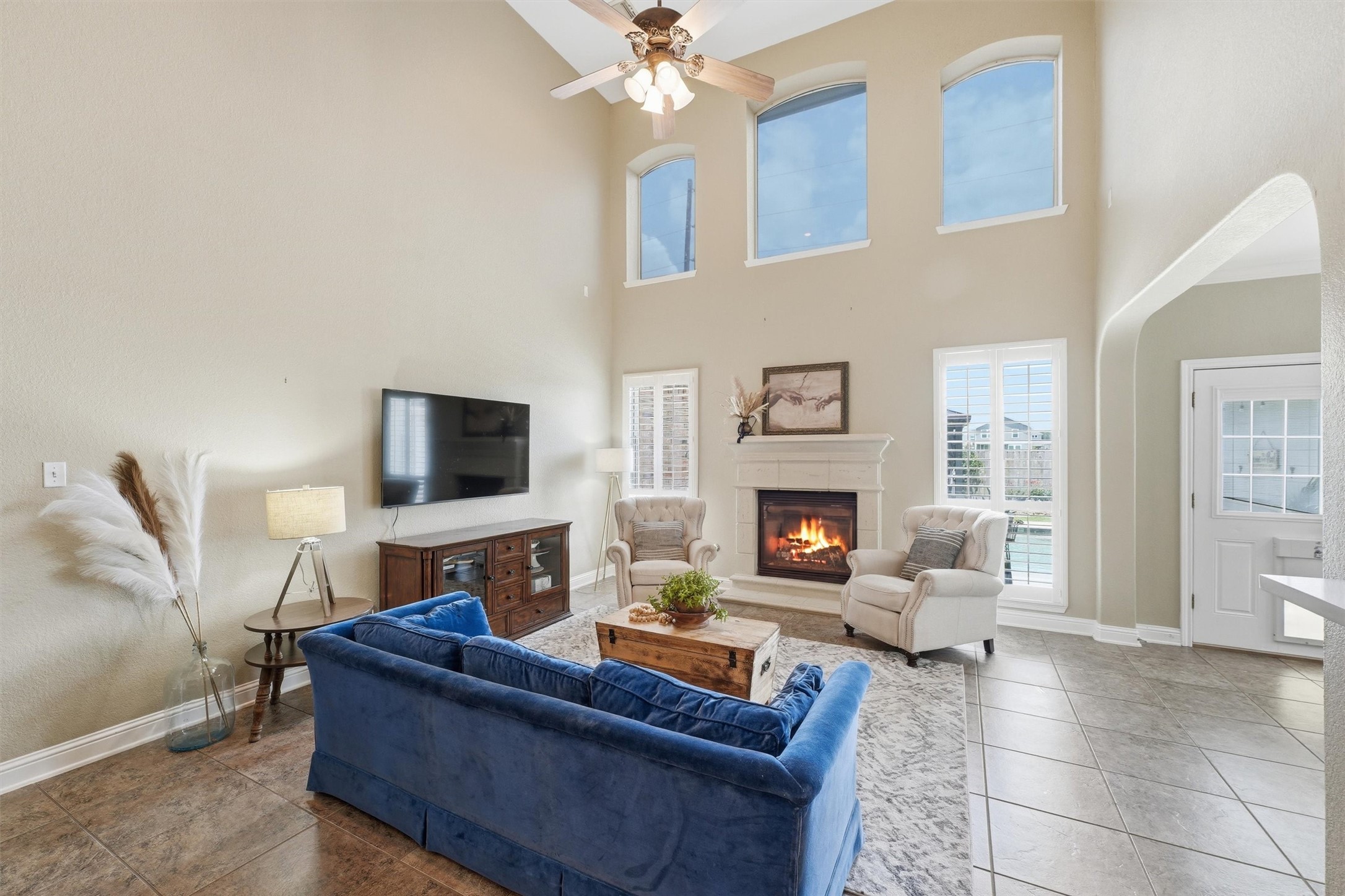 25181 Ramrock Drive Porter, TX 77365 - Photo 10 of 35 a living room with furniture a fireplace and a flat screen tv