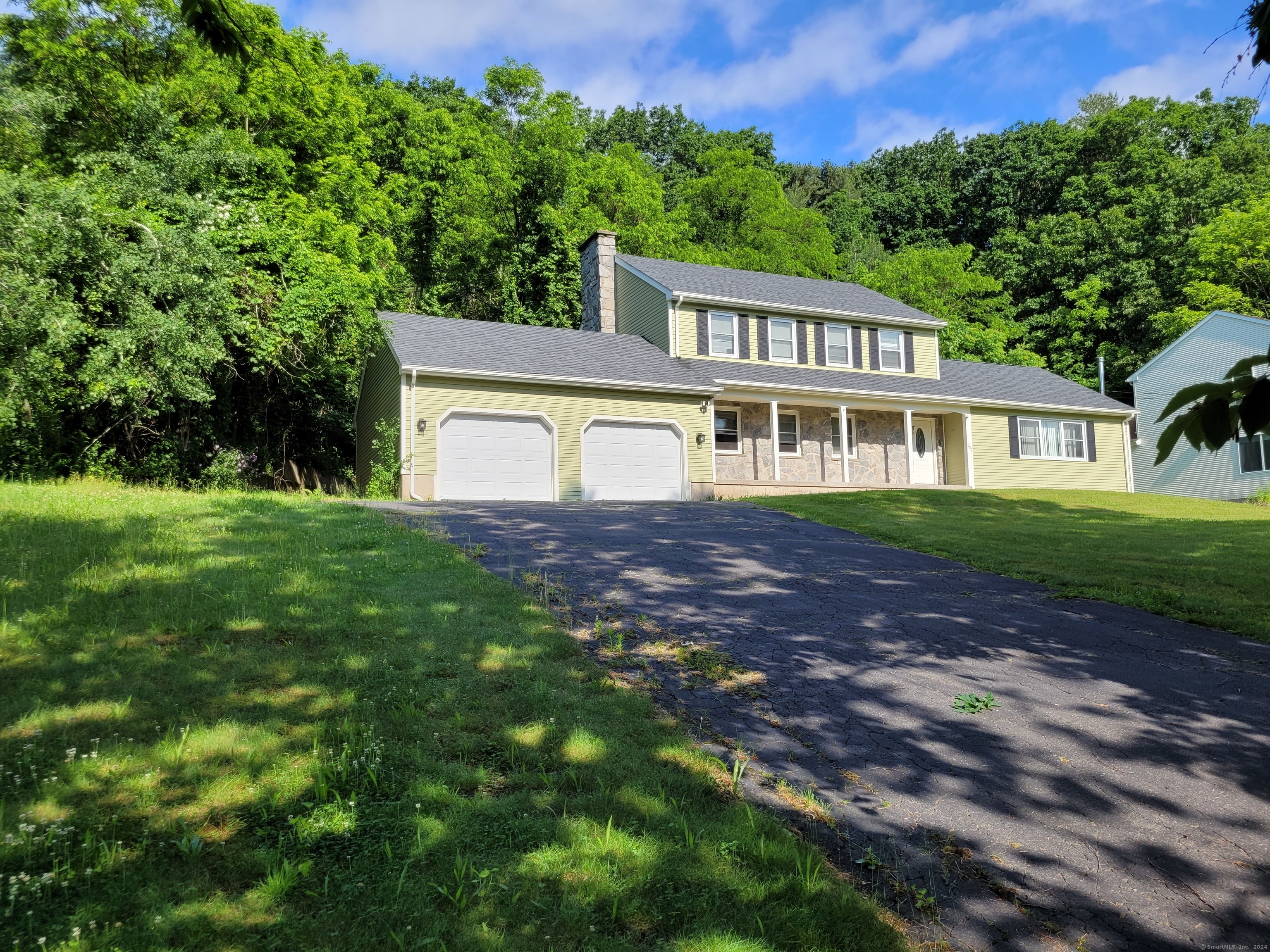 205 Perkins Street Bristol, CT 06010 - Photo 1 of 1 a view of a house with a big yard and large trees