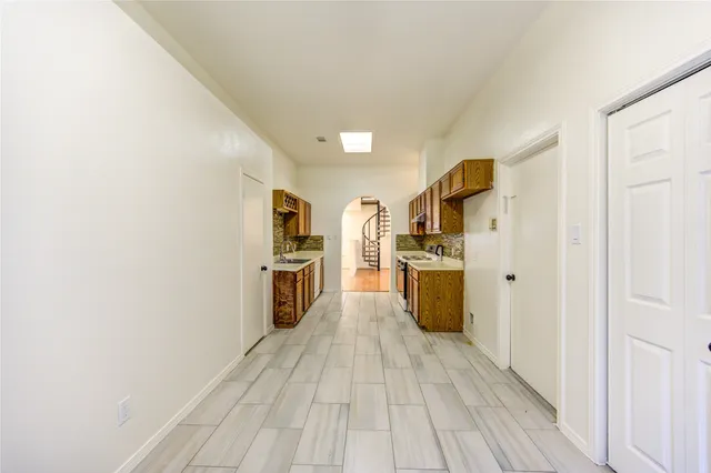 a kitchen with cabinets and stainless steel appliances