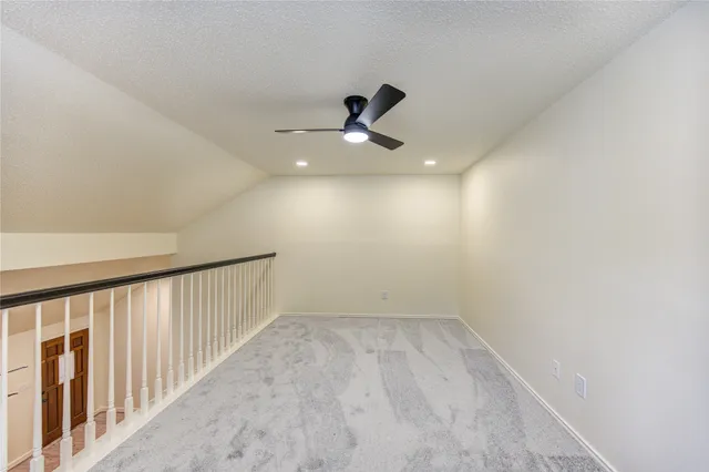 a very nice looking room with a ceiling fan