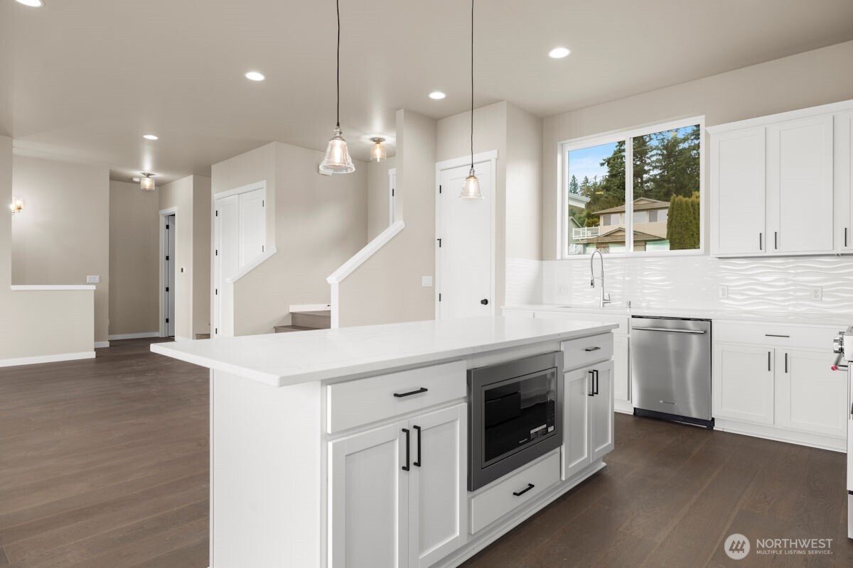 2216 Cleven Park Road Camano Island, WA 98282 - Photo 11 of 38 a kitchen with a stove a sink and a refrigerator