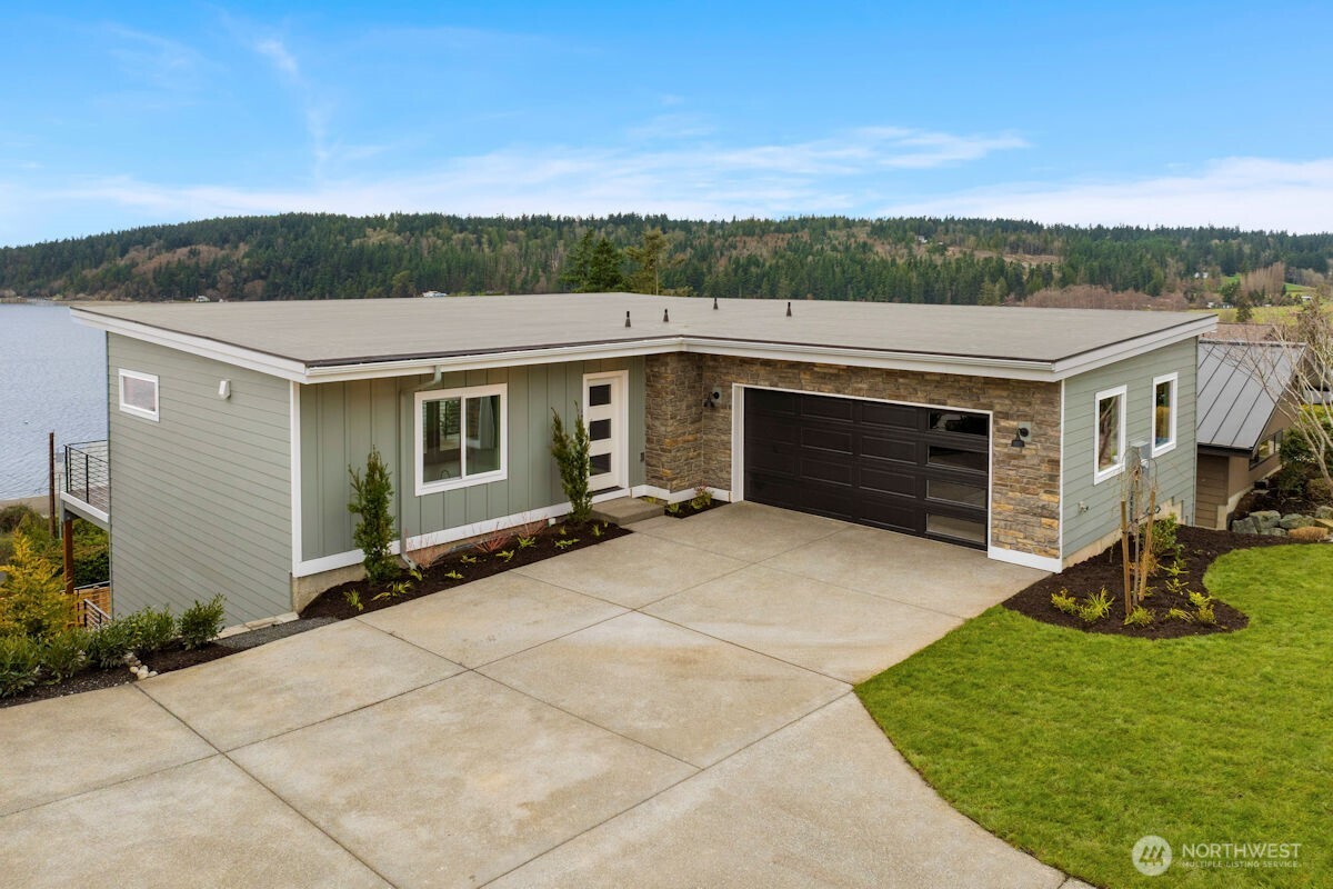 2216 Cleven Park Road Camano Island, WA 98282 - Photo 2 of 38 a view of house with backyard outdoor seating and green space
