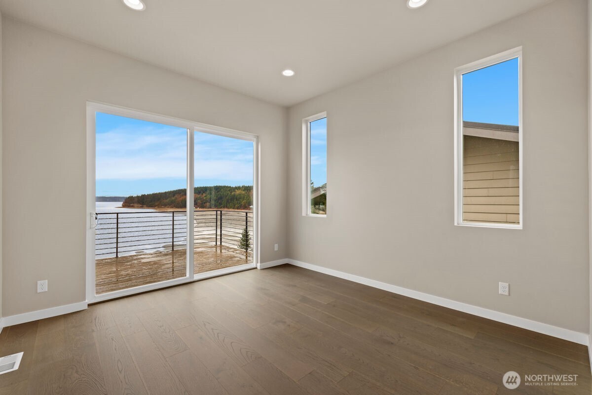 2216 Cleven Park Road Camano Island, WA 98282 - Photo 22 of 38 a view of an empty room with a window