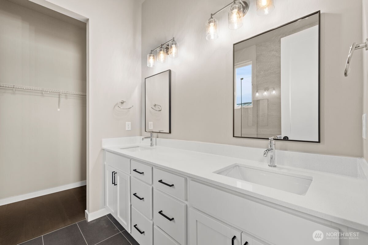 2216 Cleven Park Road Camano Island, WA 98282 - Photo 24 of 38 a bathroom with double sink and a mirror