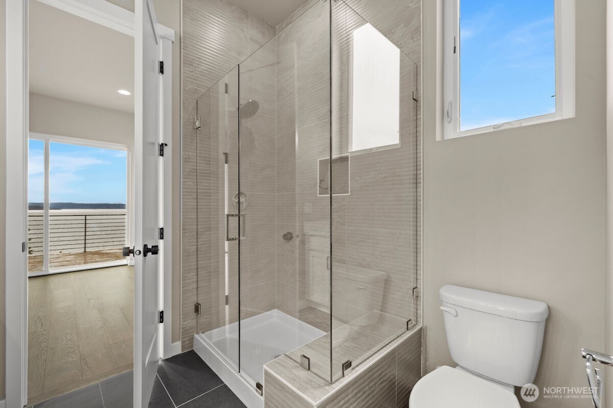 2216 Cleven Park Road Camano Island, WA 98282 - Photo 25 of 38 a bathroom with a shower toilet and sink