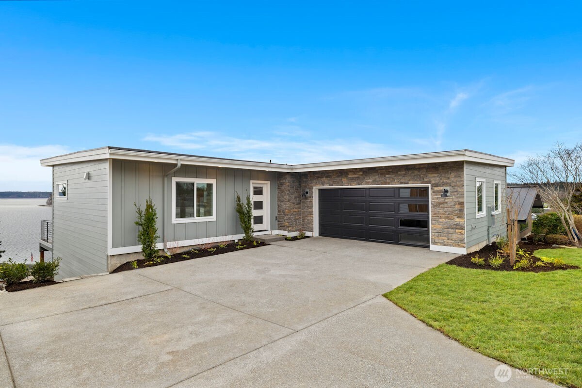 2216 Cleven Park Road Camano Island, WA 98282 - Photo 3 of 38 front view of a house with a yard