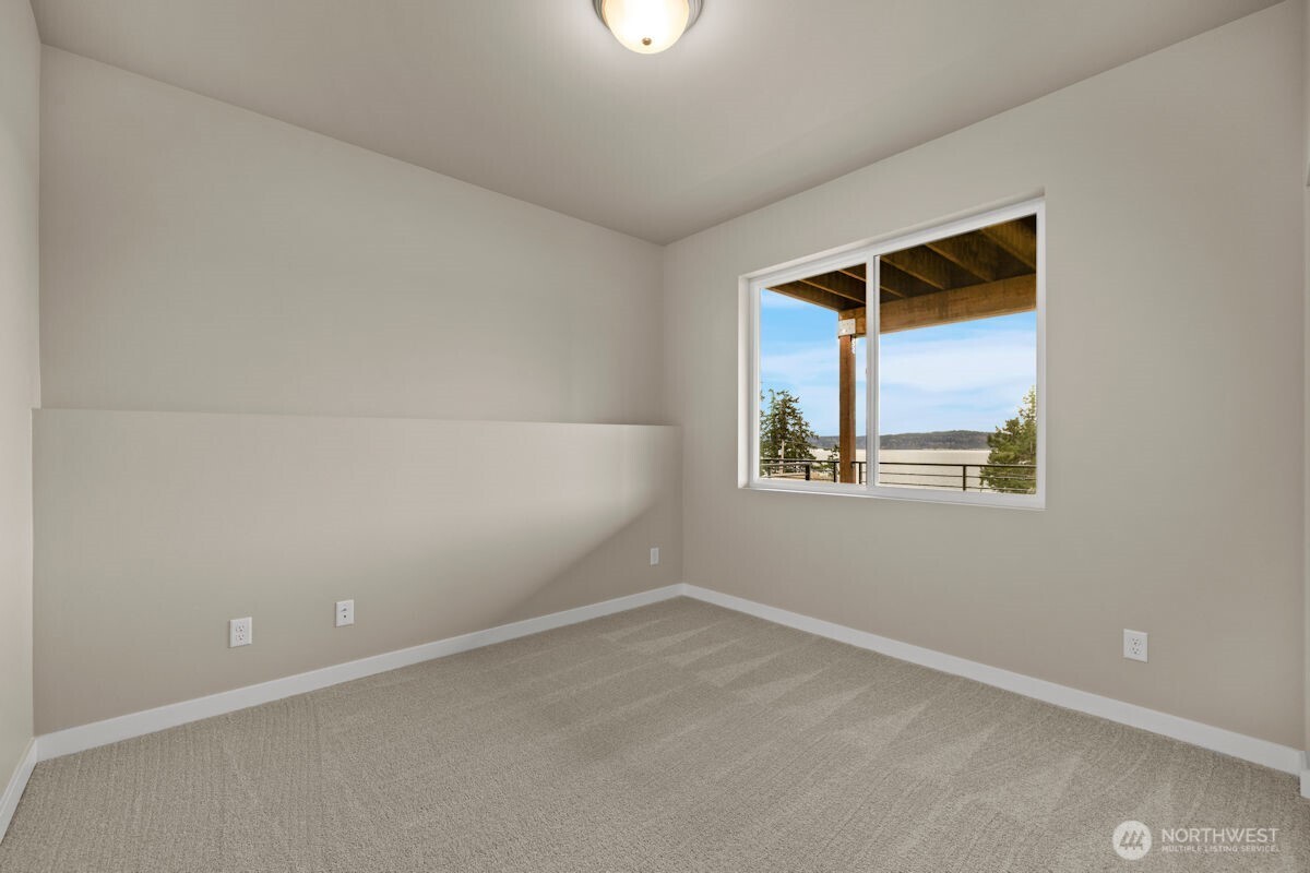 2216 Cleven Park Road Camano Island, WA 98282 - Photo 32 of 38 an empty room with a window
