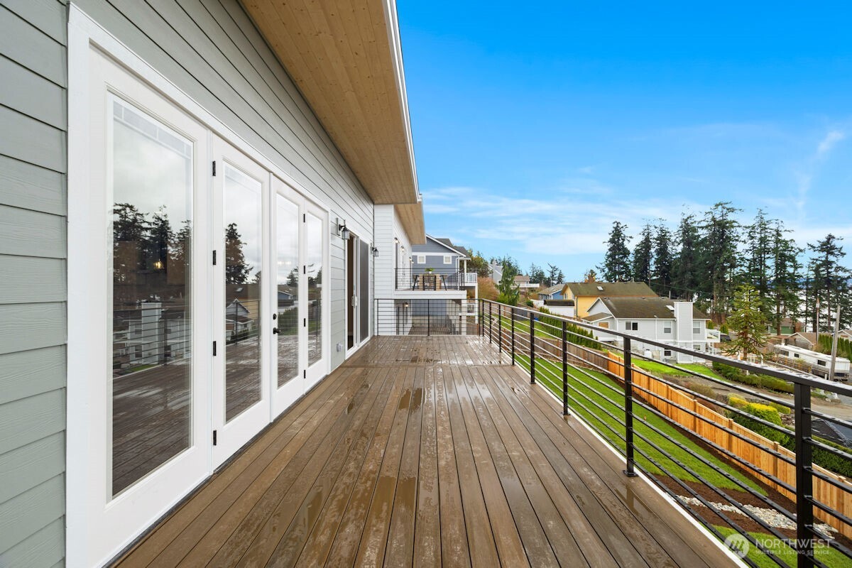 2216 Cleven Park Road Camano Island, WA 98282 - Photo 37 of 38 a view of a balcony with wooden floor and city view