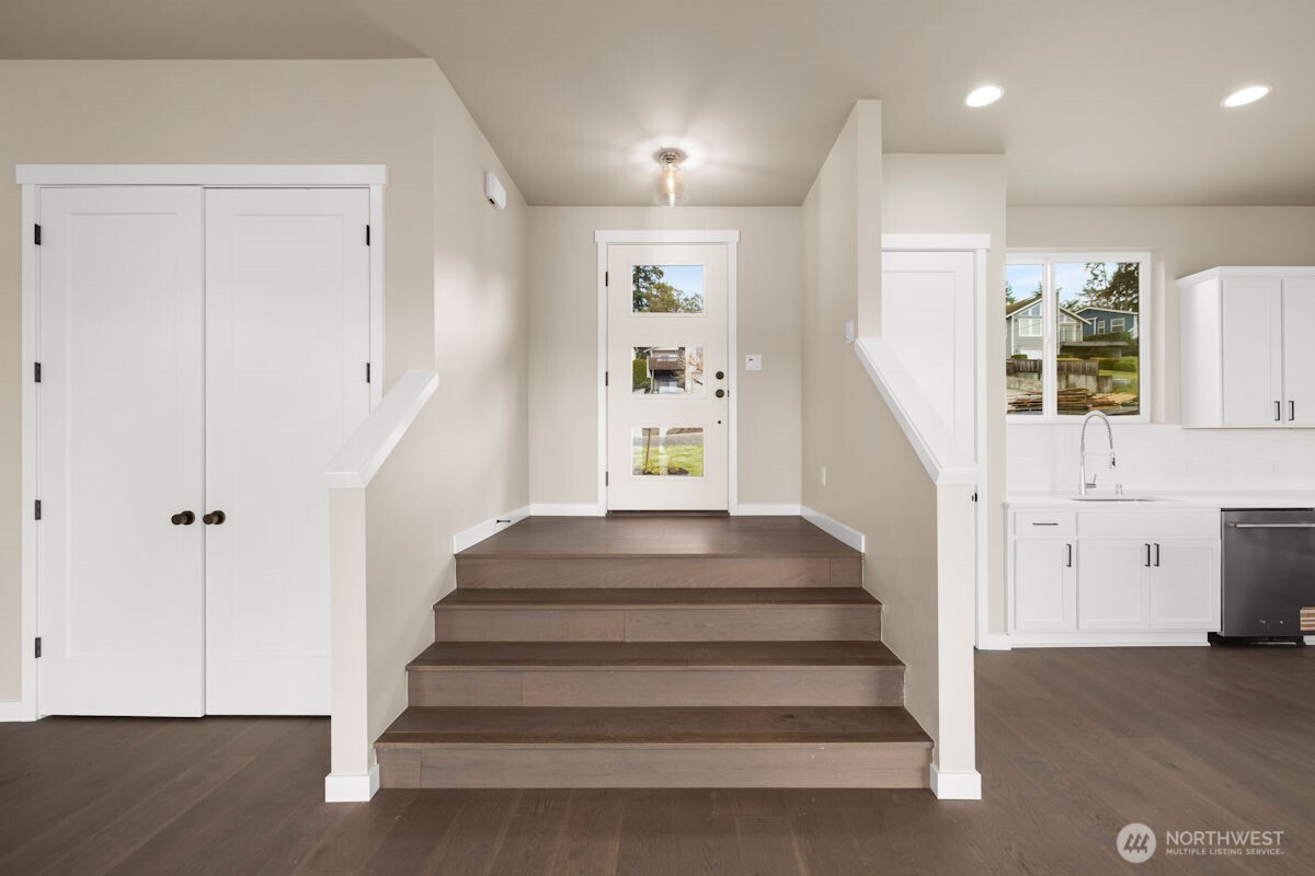 2216 Cleven Park Road Camano Island, WA 98282 - Photo 7 of 38 a view of entryway with wooden floor and front door