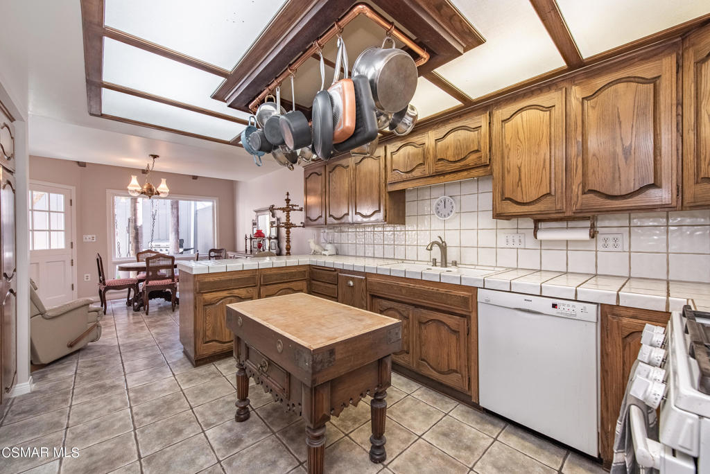 2025 Napoli Drive Oxnard, CA 93035 - Photo 12 of 47 a kitchen with a sink and cabinets
