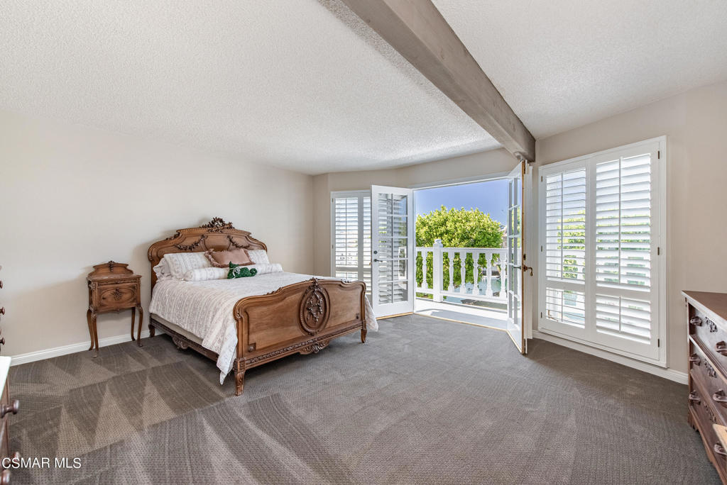 2025 Napoli Drive Oxnard, CA 93035 - Photo 16 of 47 a bed sitting in a spacious bedroom next to a window