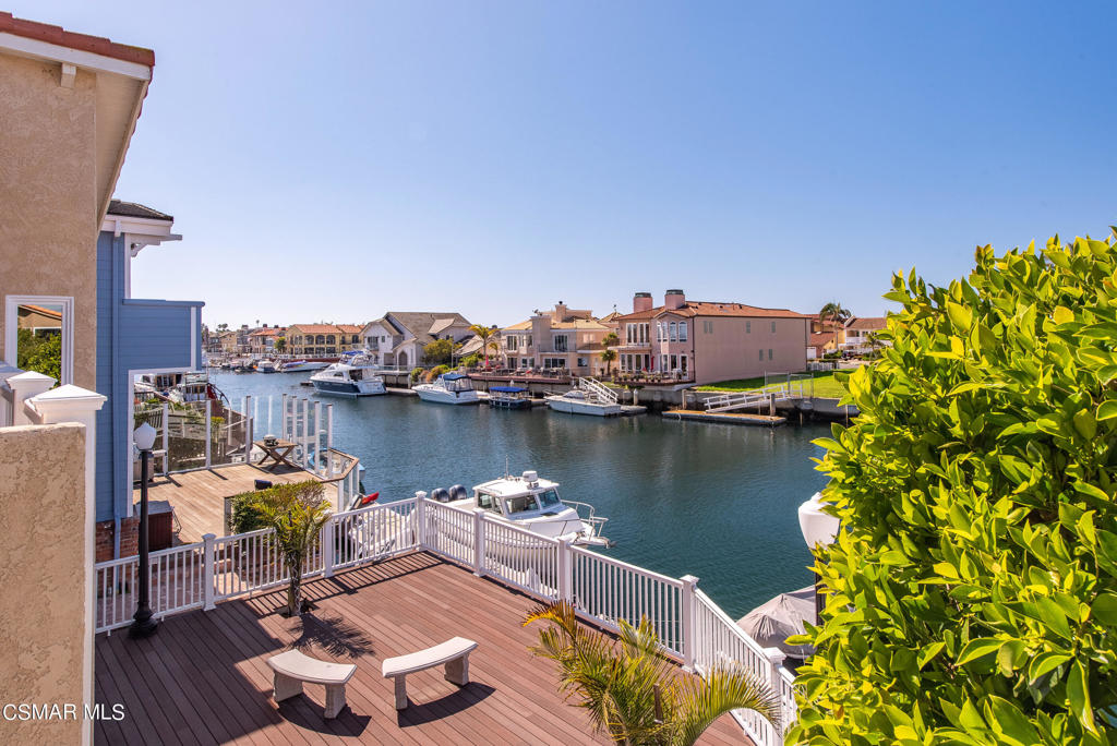 2025 Napoli Drive Oxnard, CA 93035 - Photo 20 of 47 a view of a lake with couches and wooden floor