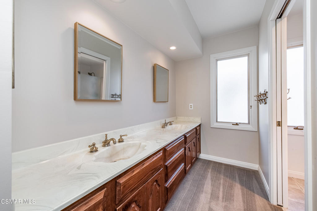 2025 Napoli Drive Oxnard, CA 93035 - Photo 23 of 47 a bathroom with a sink and a mirror