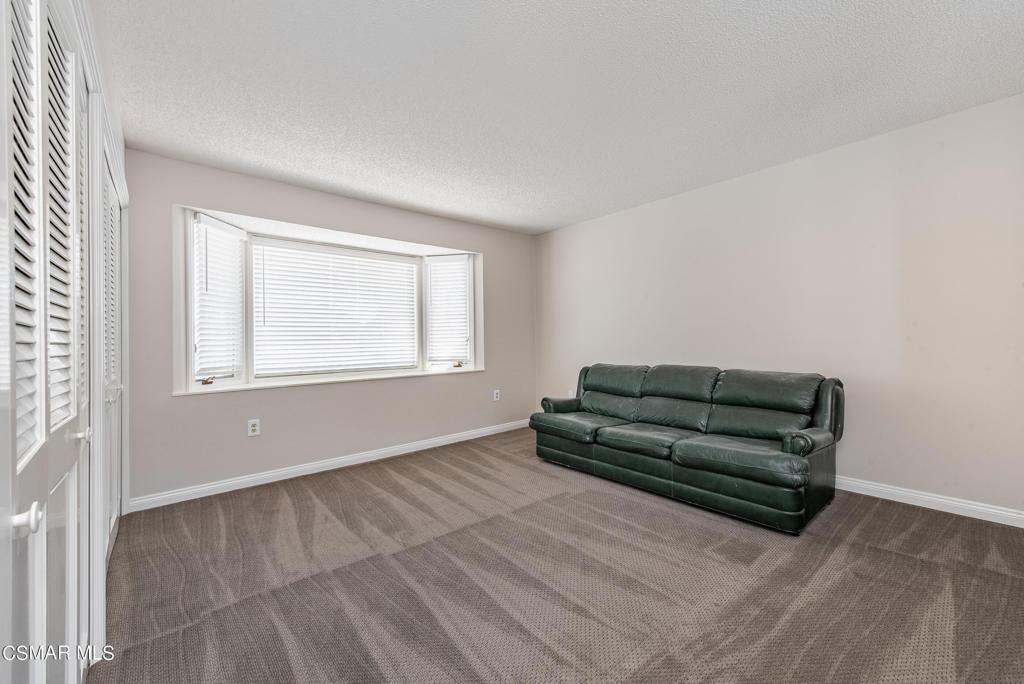 2025 Napoli Drive Oxnard, CA 93035 - Photo 28 of 47 a living room with furniture and a window