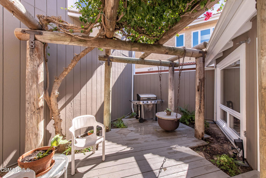2025 Napoli Drive Oxnard, CA 93035 - Photo 31 of 47 a view of a patio with table and chairs and potted plants