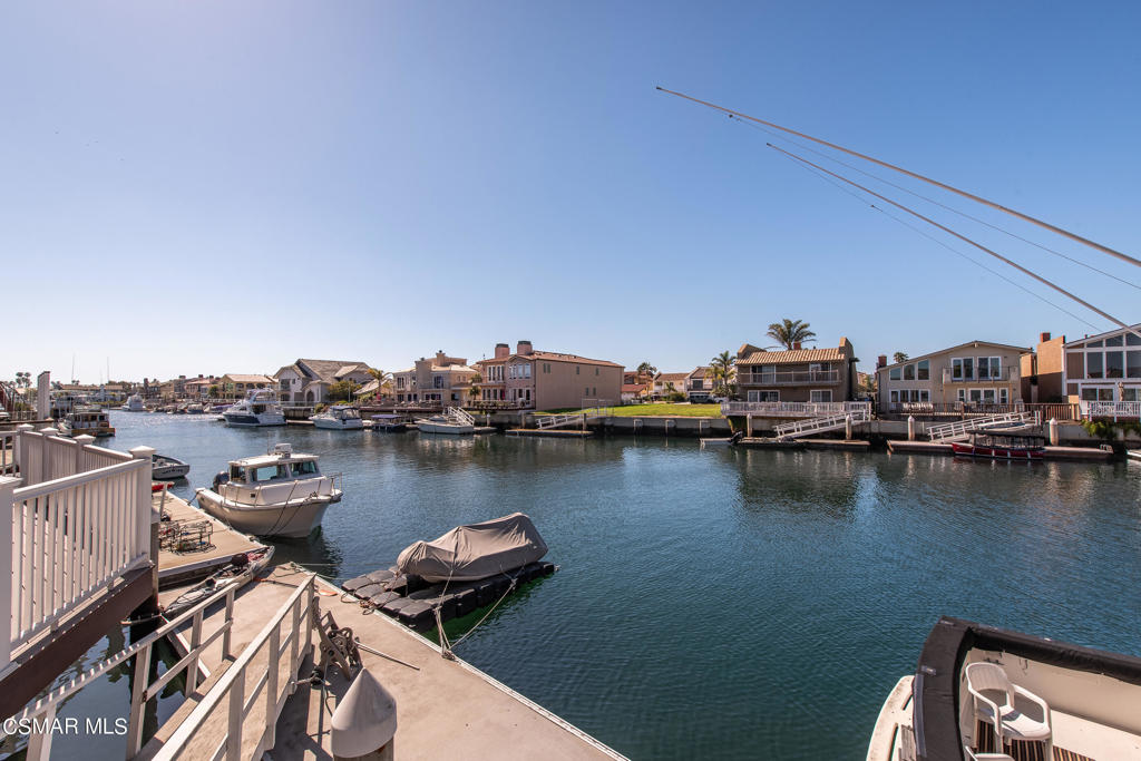 2025 Napoli Drive Oxnard, CA 93035 - Photo 36 of 47 a view of a lake with boats and trees in the background