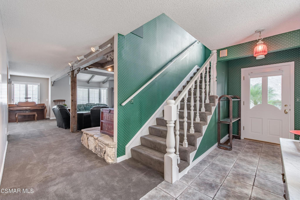 2025 Napoli Drive Oxnard, CA 93035 - Photo 5 of 47 a view of a livingroom with furniture and stairs