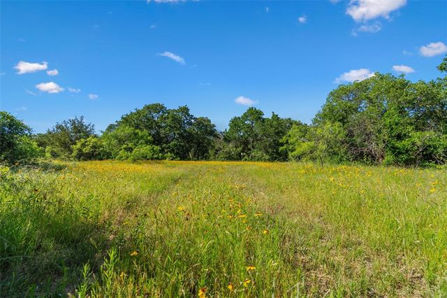 a view of a lake with a big yard