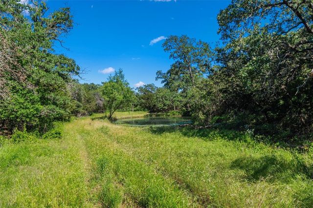 a view of a lake with houses in background