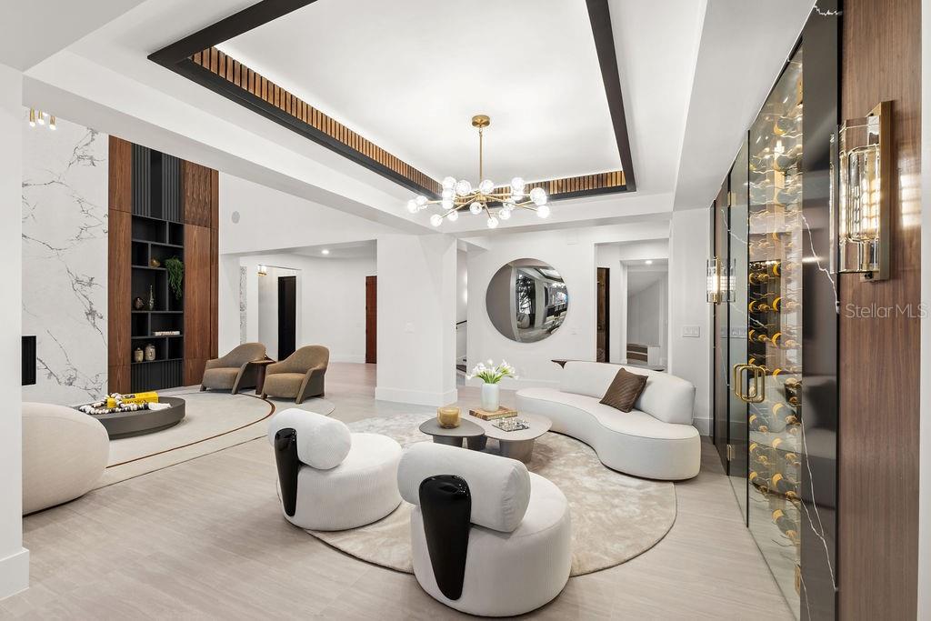 9725 Chestnut Ridge Drive Windermere, FL 34786 - Photo 14 of 55 a living room with furniture and a large mirror