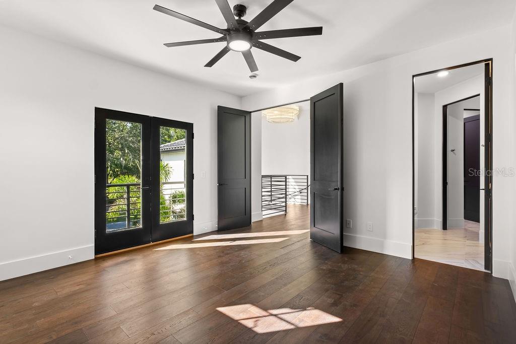 9725 Chestnut Ridge Drive Windermere, FL 34786 - Photo 35 of 55 a view of an empty room with a window and wooden floor