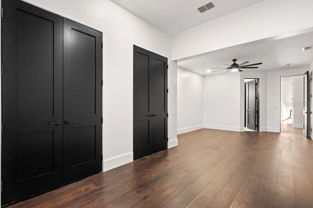 9725 Chestnut Ridge Drive Windermere, FL 34786 - Photo 36 of 55 an empty room with wooden floor closet and windows