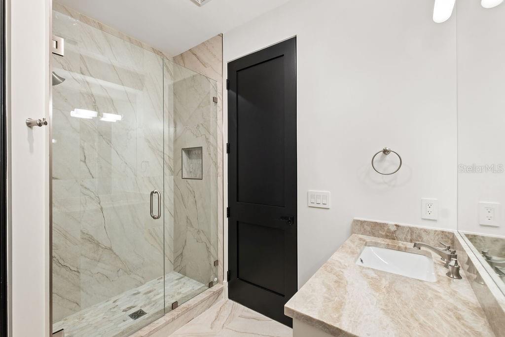 9725 Chestnut Ridge Drive Windermere, FL 34786 - Photo 42 of 61 a bathroom with a bathtub and a shower
