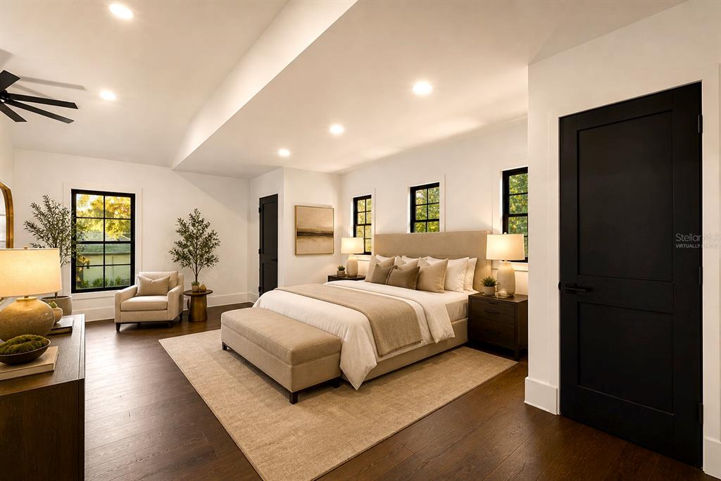 9725 Chestnut Ridge Drive Windermere, FL 34786 - Photo 44 of 61 a bedroom with a bed couch and a large window