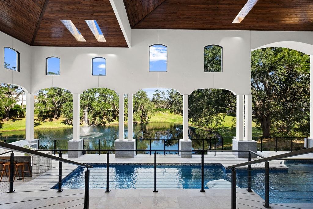 9725 Chestnut Ridge Drive Windermere, FL 34786 - Photo 50 of 61 a view of swimming pool with seating area and windows