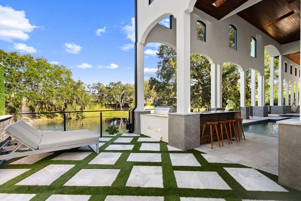 9725 Chestnut Ridge Drive Windermere, FL 34786 - Photo 56 of 61 a view of a patio with couches table and chairs