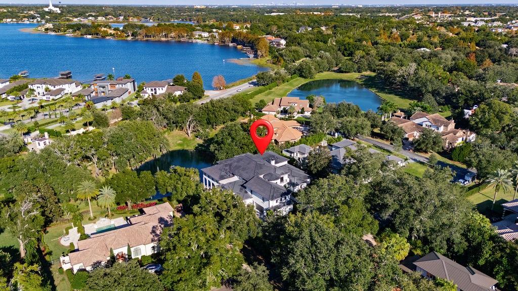 9725 Chestnut Ridge Drive Windermere, FL 34786 - Photo 59 of 61 an aerial view of a houses with a yard
