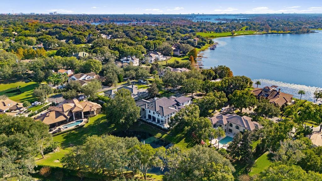 9725 Chestnut Ridge Drive Windermere, FL 34786 - Photo 60 of 61 an aerial view of a houses with a lake
