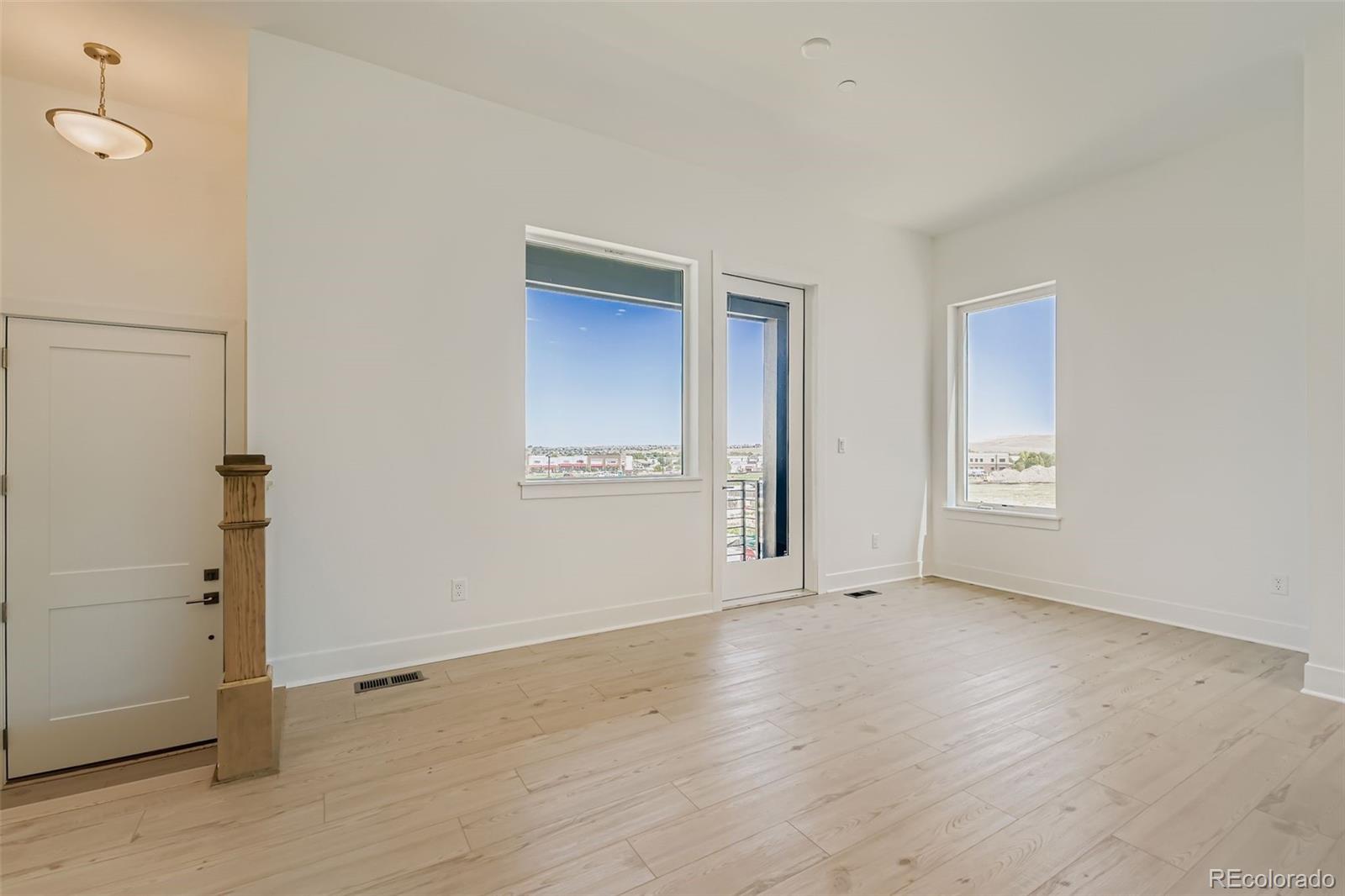 622 Saddle Drive Erie, CO 80516 - Photo 6 of 25 an empty room with windows
