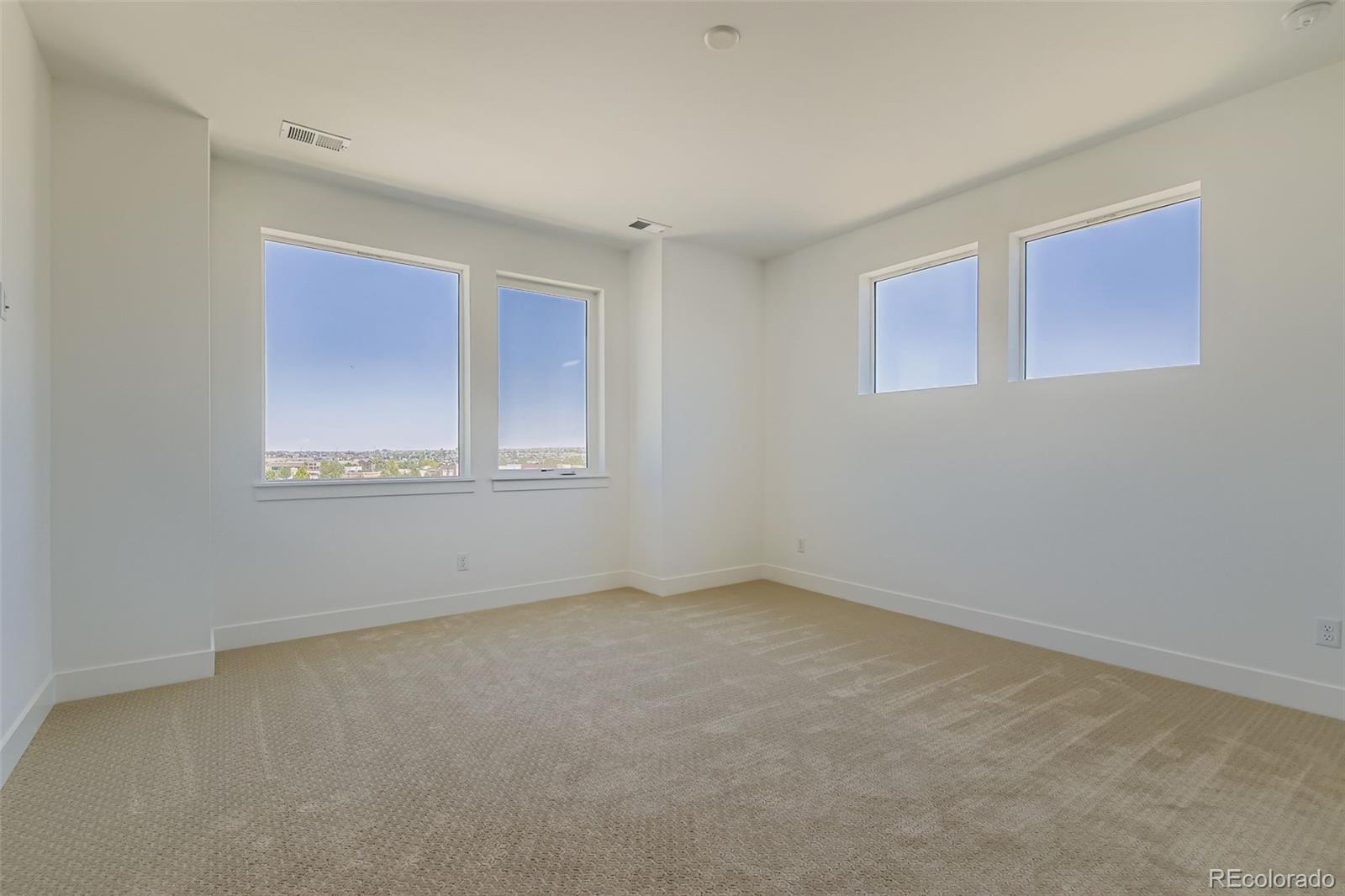 622 Saddle Drive Erie, CO 80516 - Photo 7 of 25 a view of an empty room with a window