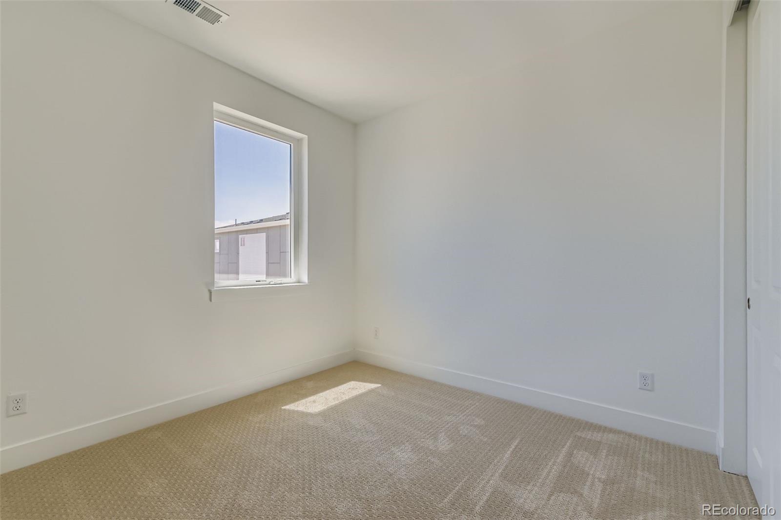 622 Saddle Drive Erie, CO 80516 - Photo 9 of 25 an empty room with a window