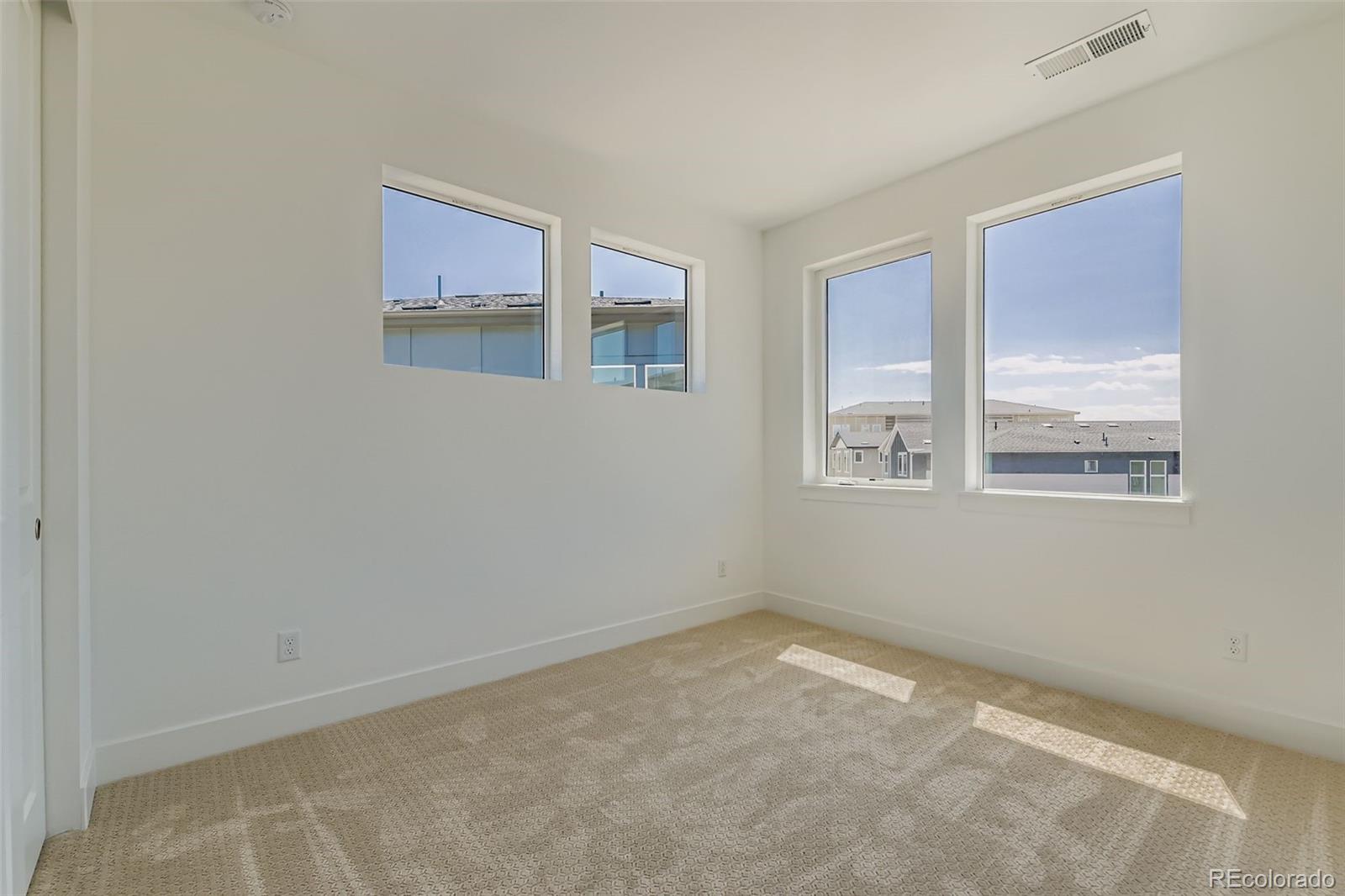 622 Saddle Drive Erie, CO 80516 - Photo 10 of 25 a view of an empty room with a window